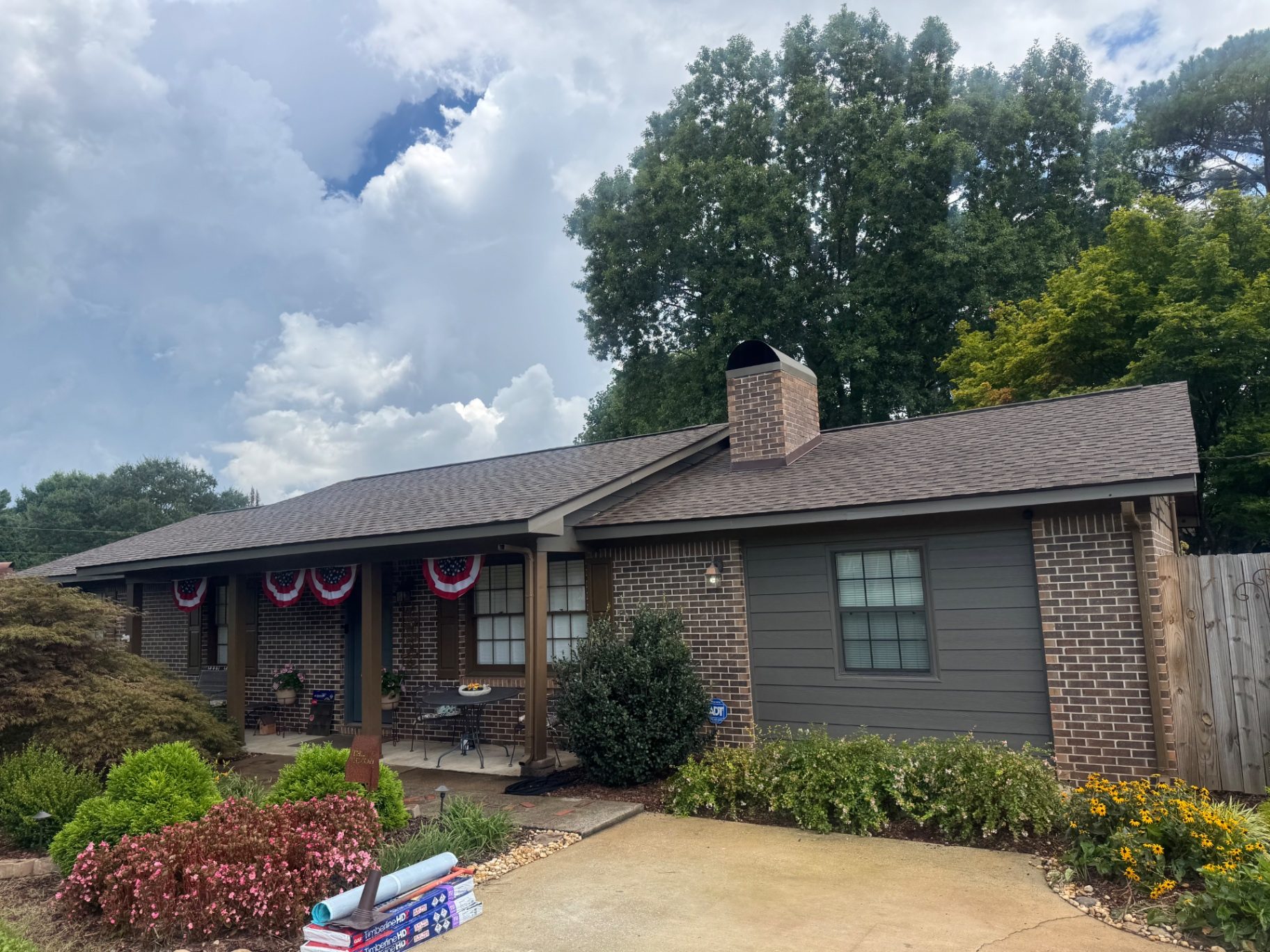 Completed asphalt shingle roof on a single-story brick ranch home in North Alabama