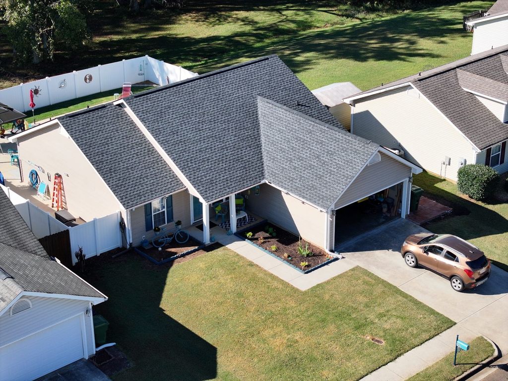 The same home after replacement, with a new architectural shingle roof installed