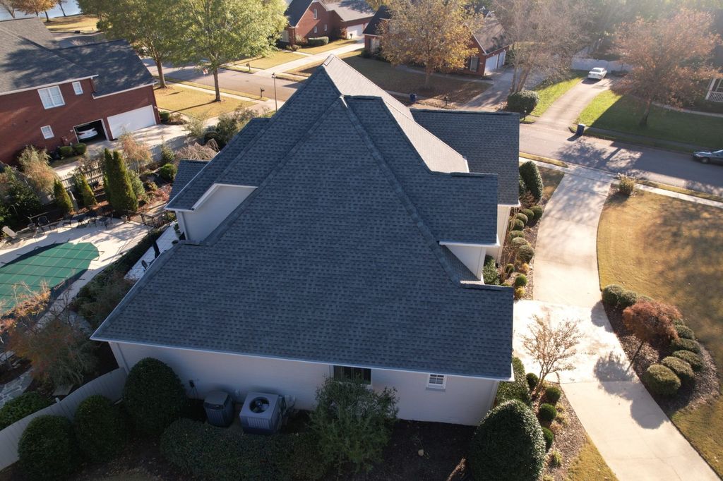 Aerial view of a finished shingle roof on a large home in North Alabama